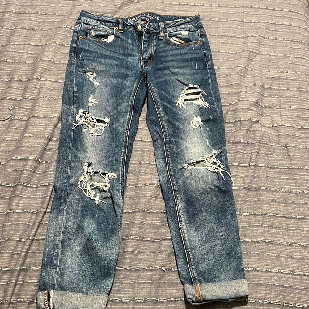 Medium wash ripped tomgirl stretch jeans